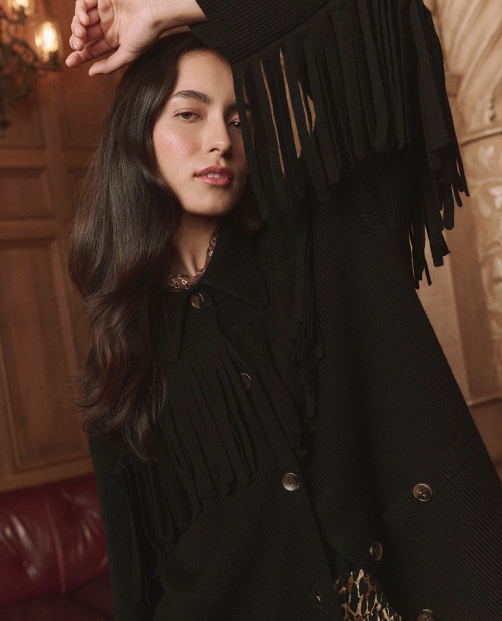 The Western Fringe Sweater Jacket in the paneled parlor