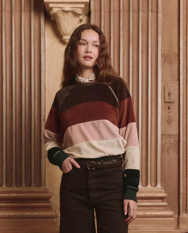 The Pieced Stripe Velour College Sweatshirt by the plaster columns